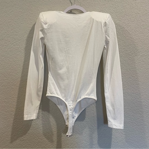 Grlfrnd Eryka Long Sleeve Jersey Knit Paddle Thong Bodysuit in White - Picture 10 of 13